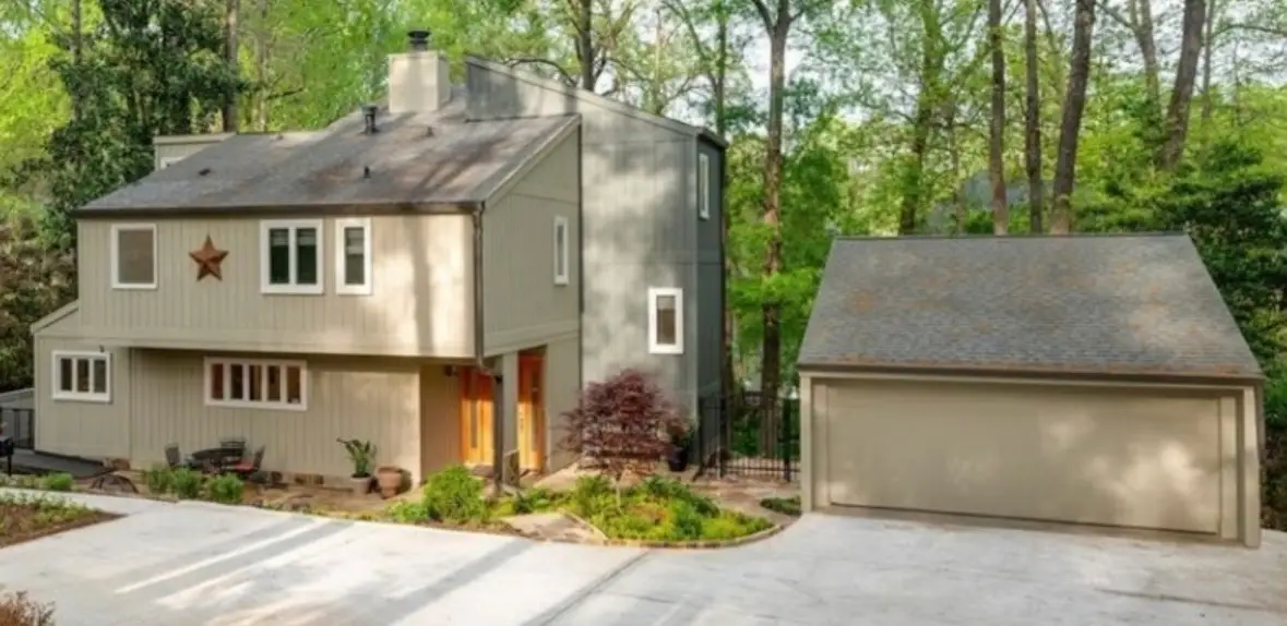 Before detached two- car garage prior to conversion into attached three-car garage with living space