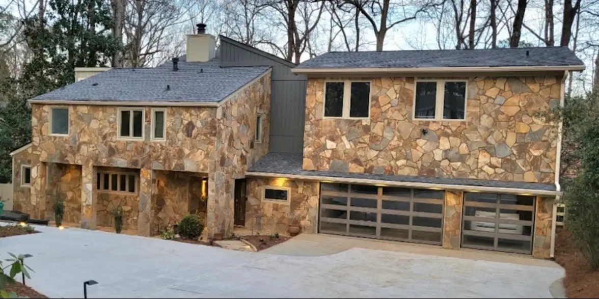 Completed attached three- car garage with living space above.