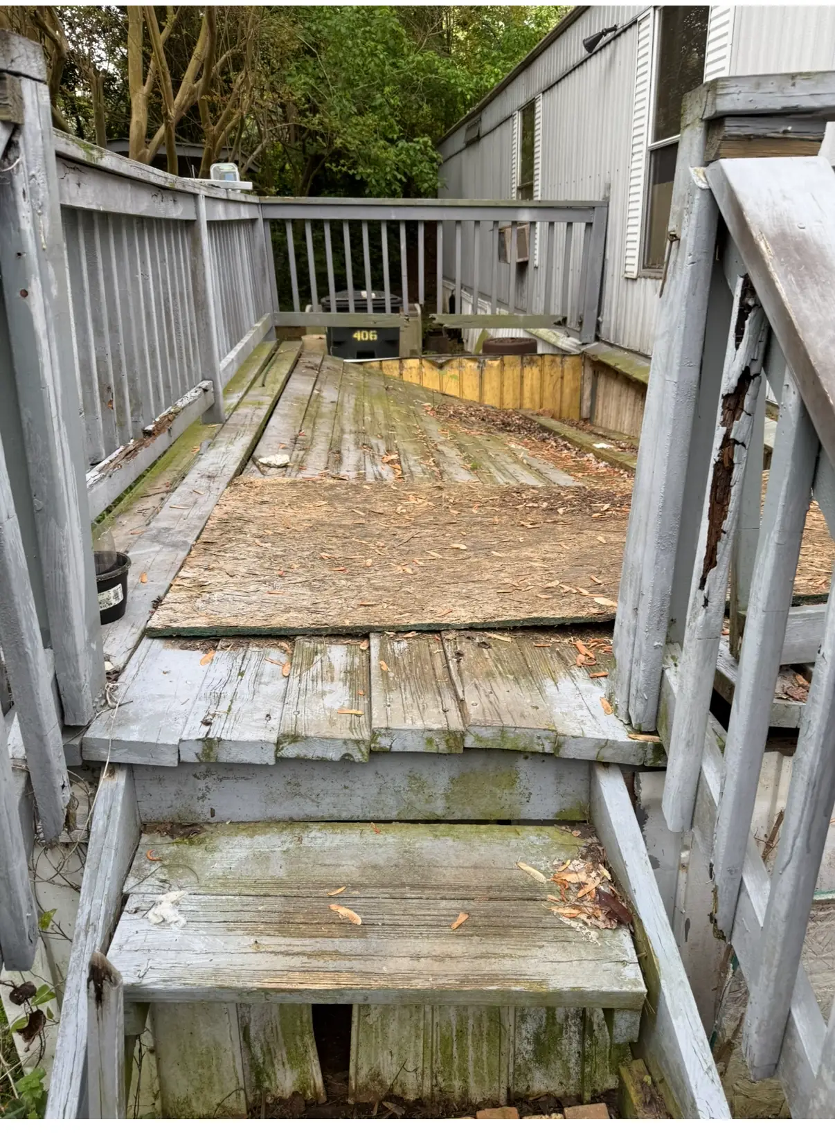 Before deck renovation with worn boards and railings in Stockbridge, GA