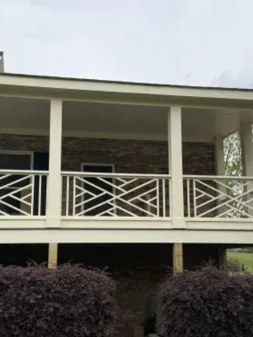 Covered screened porch with custom railing and outdoor living space